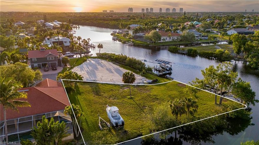 $70,000 PRICE DROP! SELLER SAYS BRING ALL OFFERS! This may be your last opportunity to Build Your Dream Home on a HUGE North Facing, riverfront lot in Bonita Springs' most desirable boating community. There is no location quite like Bonita Farms. This property is a quick boat ride to beautiful beaches and world-class fishing in the Gulf of Mexico, with DEEP WATER GULF ACCESS & HIGH BRIDGES. What sets this neighborhood apart from any other is how close it is to the up-and-coming downtown Bonita Springs. Hop on your bike and cruise down to Sugarshack or Rooftop at Riverside Food Truck Park or attend one of the many fun events always happening at Riverside Park. With other major projects in the works, like numerous upscale restaurant proposals, you can rest assured that you are making a great investment in a FAST-GROWING CITY. This little piece of paradise already has a dock and seawall in place, with 83 FEET OF RIVER FRONTAGE and 132 FEET OF CANAL FRONTAGE. Now, it’s time to start designing your dream home with exceptional views of the Imperial River and stunning sunsets & sunrises.