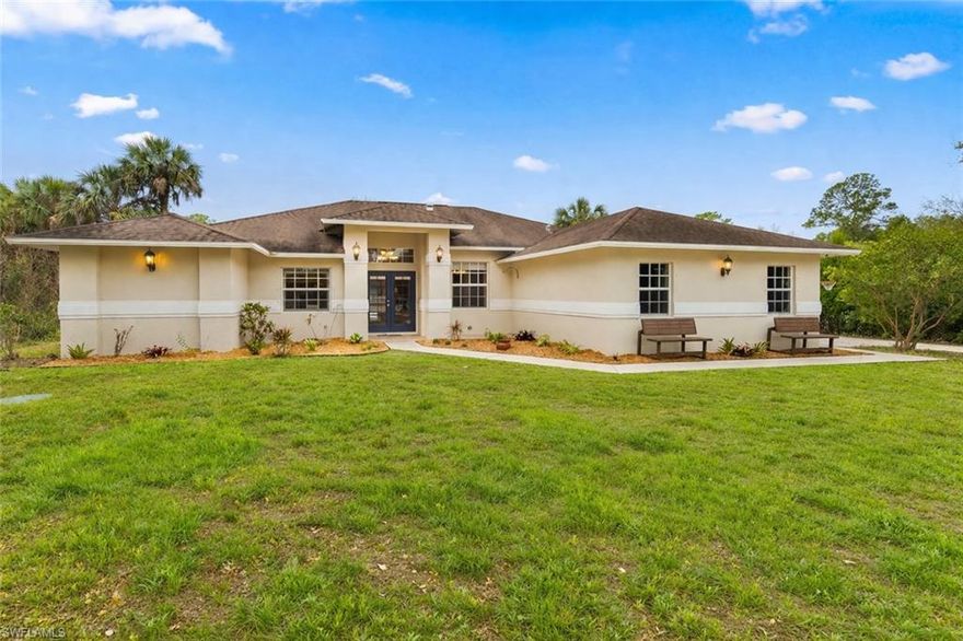 Welcome to your private slice of country living in Golden Gate Estates! Situated on a fully fenced and gated 2.27 acres, this charming 3-bed + den home offers the perfect blend of comfort, style, and functionality—with room to live, work, and play.  Inside, you’ll find beautifully updated LVT flooring throughout the home and a desirable split floorplan that provides both privacy & flexibility. The updated master bathroom is a true retreat, featuring quartz countertops, dual sinks, walk-in closet, and an oversized walk-in shower designed with both style and relaxation in mind.  The heart of the home is the thoughtfully updated, farmhouse-style kitchen—complete with shiplap accents, expansive quartz countertops, open shelving, and a cozy eat-in dining area that’s perfect for everyday living or entertaining.  Step outside and experience the lifestyle this property was made for!  A generous screened lanai opens to an impressive outdoor space featuring a newly added saltwater pool, surrounded by an iron fence and an oversized pool deck with ample room for lounging, dining, and hosting. Whether you envision weekend BBQs, evening swims, or simply relaxing under the Florida sun, this backyard delivers.  This is more than just a home—it’s a lifestyle opportunity!  The recent cold temperatures took its toll on the gorgeous, tropical landscaping and lawn.  It's only a matter of time before the figs, fruit trees, and flowering tropical plants will be in full display again!  Don't forget there is no HOA on this home so if you have dreams of gathering eggs from your own chickens or milk from your goats, you have the freedom to do so and are already set up with a chicken coop and additional enclosure.  Curtain rods and curtains will not convey with the sale of the home.