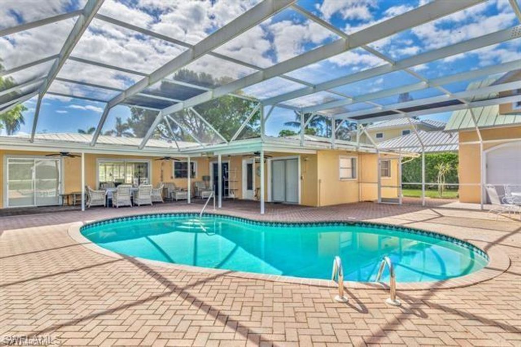 Photo of 737 Mooring Line DR, NAPLES, FL 34102 (MLS # 225015675)