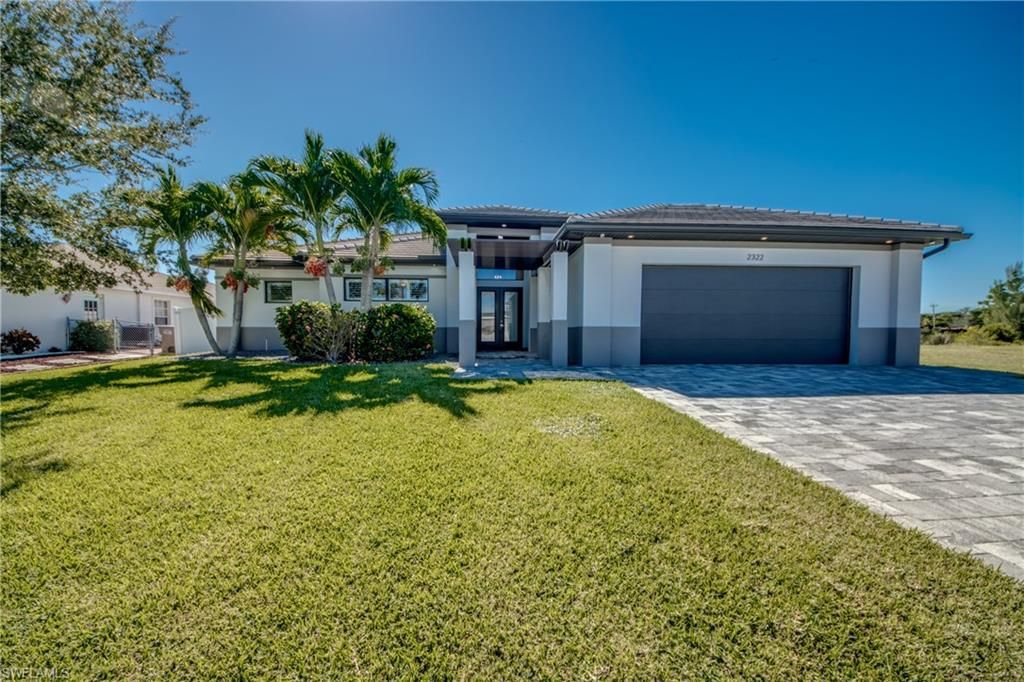 Photo of 2322 SW 19th ST, CAPE CORAL, FL 33991 (MLS # 2025017978)