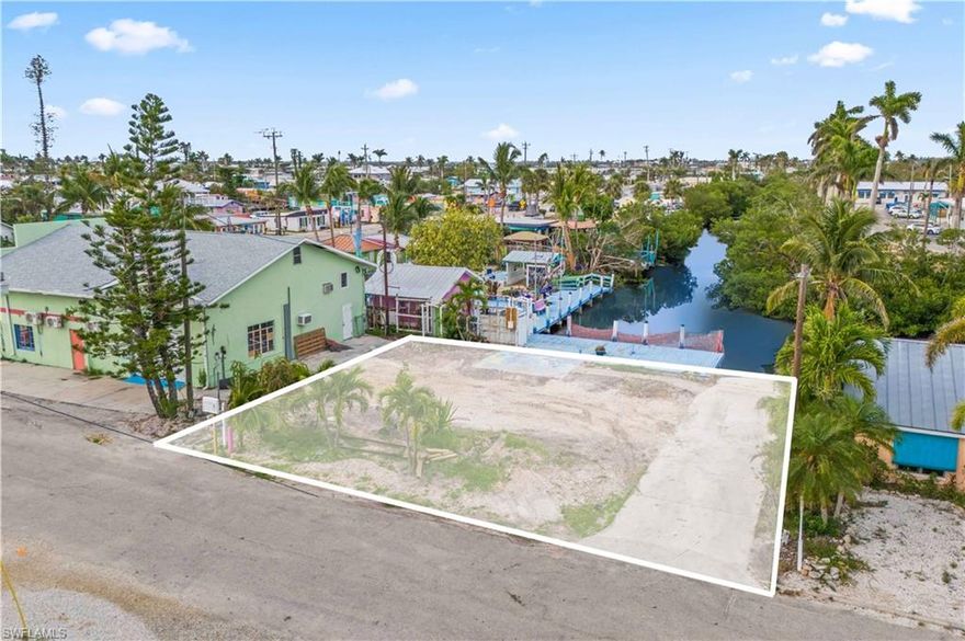 Rare opportunity to own a prime waterfront lot in the heart of Matlacha. With direct sailboat access and deep water, you're less than a minute from the open waters of Matlacha Pass and the Gulf of Mexico. This intersecting canal location offers wide water views and breathtaking sunsets. The area is teeming with wildlife—dolphins, manatees, and eagles are frequent visitors—and it's known as one of the best fishing spots in Southwest Florida.
An extensive dock is already in place, perfect for boating, kayaking, or simply enjoying the serene waterfront setting. The lot has been cleared and is ready for your custom home to be built. Located in a close-knit island community, the property is within easy walking distance to local restaurants, shops, and galleries. Matlacha is actively coming back to life, with businesses reopening and the island’s unique charm returning stronger than ever. Sold As-Is, cash only. Motivated seller—bring your vision and create your waterfront escape.