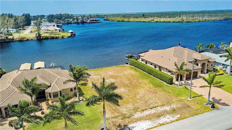 Outstanding Southern exposure, direct Gulf access lot with seawall in place. Enjoy over 700 feet of basin and intersecting canal views. This cleared lot is ready for you to build your dream home in Southwest Florida. Enjoy a scenic boat ride to the Gulf of Mexico or fish right from your dock! This residential building lot is surrounded by beautiful homes.