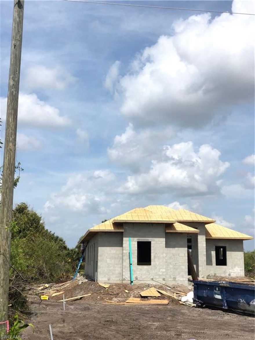 Single family home under construction, will be completely finished by June 10,2020 with beautiful kitchen, stainless steel appliances, granite counter top, porcelain tile throughout entire home, beautiful bathrooms, wood cabinets, impact windows & doors, paved driveway and much more.
