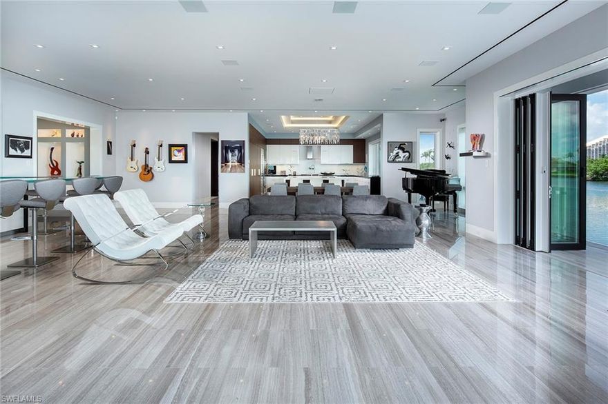 Completely redesigned from the ground up in 2013 and just steps away from your private, deeded beach access to the gorgeous glistening waters of the Gulf of Mexico. This coveted southeastern exposed home on the Venetian Bay is truly remarkable, sprawling on 115ft of water. Offering a sophisticated blend of coastal design and spectacular uninterrupted panoramic views. Custom details and extraordinary finishes are found throughout the four-bedroom plus a den, four-and-a-half-bath open floor plan. Showcasing imported limestone and marble flooring, full smart home capability from your phone, Quartz waterfall counters throughout and a gourmet kitchen, ideal for entertaining or just relaxing. This private setting awaits on an expansive outdoor oasis, providing the perfect tropical retreat. Only a 5 minute walk along the bay to the exclusive shopping and dining at the Venetian Village, this is your chance to own a piece of paradise. Watch our Video.