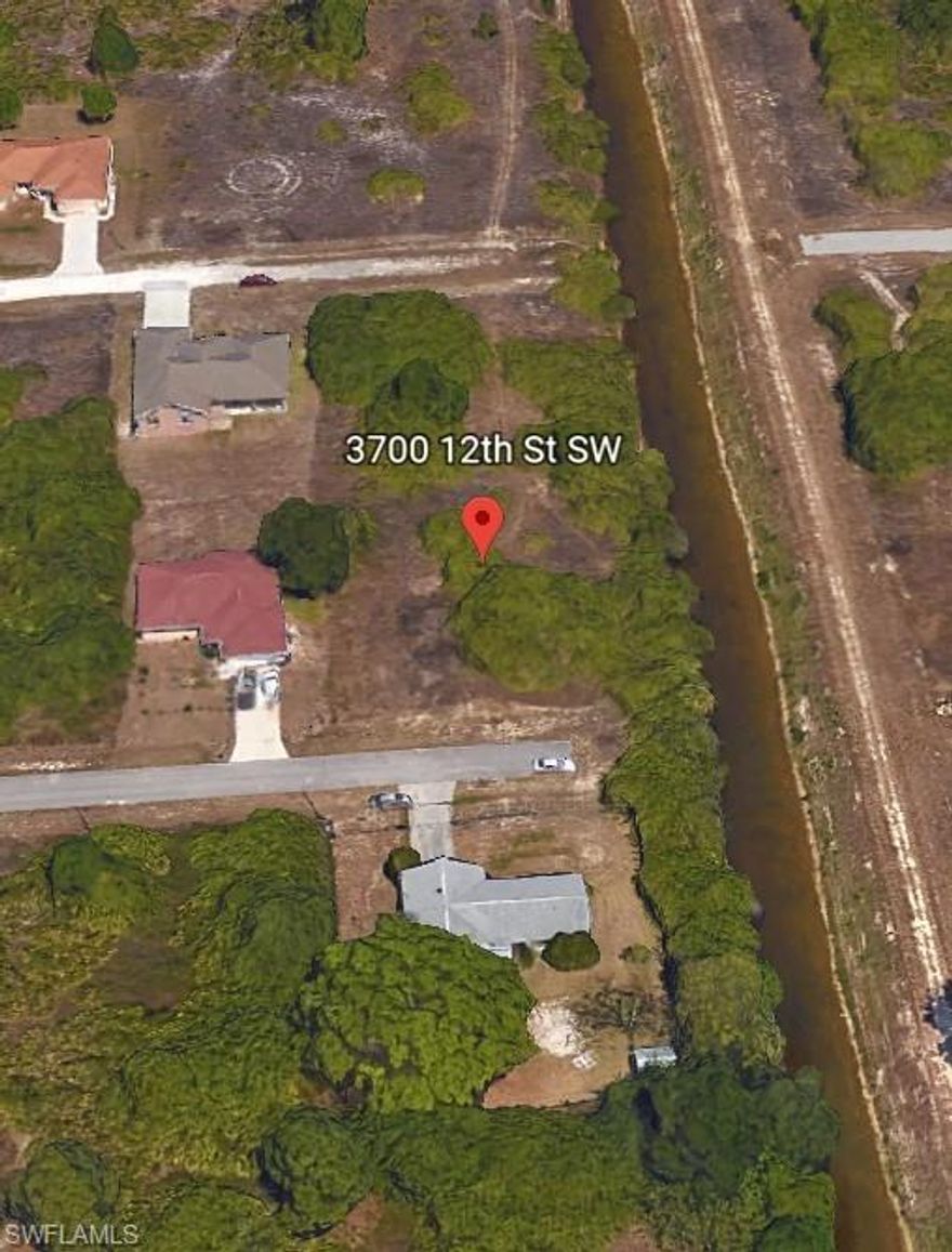 You won't find a better spot to build than this over-sized .38 acre corner lot on a canal.  This lot is at the end of the road- making it the perfect spot to relax, without traffic zipping by.  Only 8 miles from The Forum.