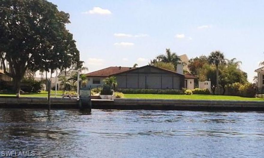 An Island Home that is Perfect for waterfront living. Beautiful appointed riverfront home on River Forest Island features fantastic river views! No expense was spared creating a relaxing, captivating atmosphere that only enhances the beautiful river views & private island living. The gourmet chef's kitchen w/ custom cherry wood cabinets, granite counters, glass-tile mosaic backsplash, custom lighting & high end stainless steel appliances. MBR shower has body wash jets. This home also features new plumbing with high-end fixtures throughout and new electrical system. High volume cathedral ceiling and beautiful diagonal tile work. Roof has upgraded metal barrel tile. A 12,000 lb boat lift & dock with water & electric.  Wonderful Florida room that has a double sided fireplace that connects to the outside patio. Home shows built 1971 however 90% remodeled in 2009.For hurricane protection accordion shutters. This home will help you understand and enjoy the true meaning of the FL Lifestyle.