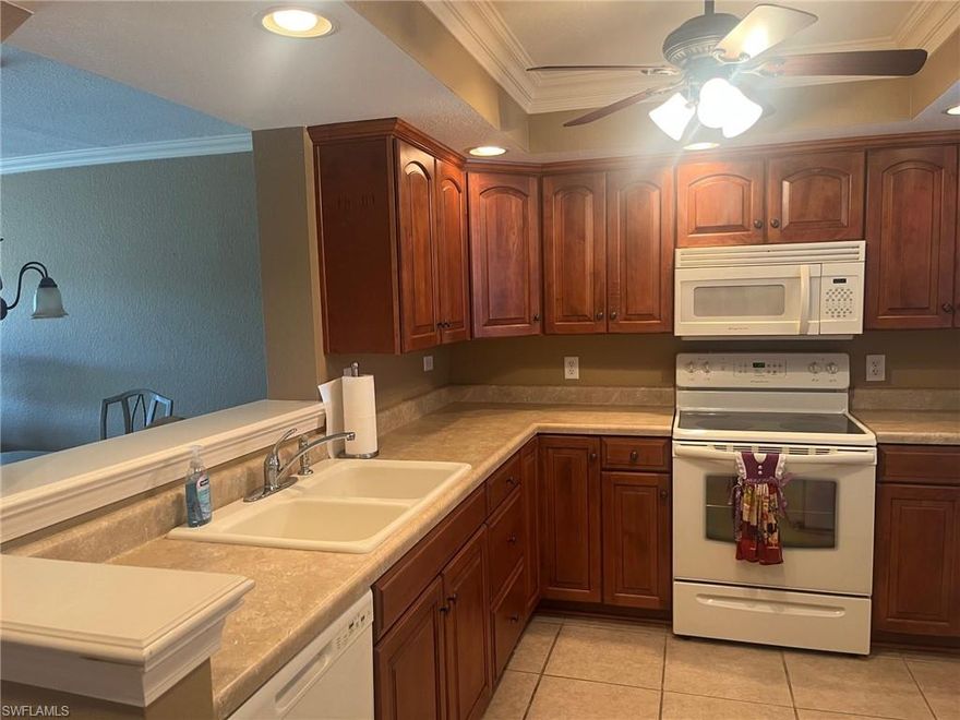 Desirable first floor condo, this spacious unit has over 1100 sq. feet of living space.  End unit for more privacy.  The Kitchen has been updated with cabinetry for lots of room for storage.  Guest bedroom has a murphy bed, and both bathrooms have updated vanities.  Tiled Kitchen, Bathrooms and Dining Room.  Carpet in the main living area and bedrooms.  Screened in lanai that overlooks a beautiful view of the golf course and lake.  CAR PORT SPACE #29 AND GOLF CART SPACE #D22 INCLUDED!!  Seven Lakes is an active 55+ community with amenities galore, which include an Executive 18-hole Golf Course where there is unlimited Golf for 2 residents per unit. 6 Heated Pools, 6 Tennis Courts, Pickle-Ball Courts, Bocce, Shuffleboard, Billiards, Library, Cards/Game Groups, Organized Events and Outings through our Full Recreation Department can help you get involved. A monthly Newsletter that puts out Calendar of Events. Tons of clubs, auditorium which host dinners and dances. A bus to take residents to other activities outside the community. Exercise Room, Lapidary, Awesome Library! Private Restaurant & Bar Has Weekly Events like Karaoke and Trivia, Theme Dinners & Happy Hours. Start Living the Seven Lakes Lifestyle Seven Lakes Golf & Tennis has Premium Location in South Fort Myers. Close to Airport, Shops and Restaurants. Minutes from the Sanibel, Captiva & Fort Myers Beaches. Come Take a look at this golf Villa and make it your next home.