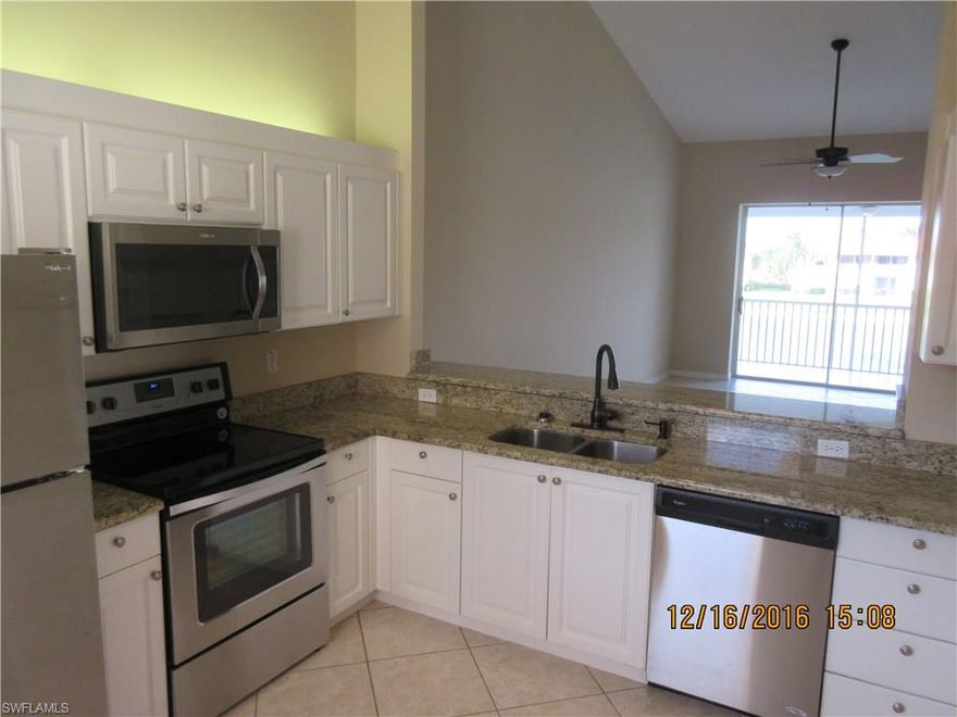 Beautifully Updated Townhouse in an excellent location convenient to Downtown Naples and I-75. This 2 bed + den and full 2 bath has plenty of space, a panoramic lake view, an attached garage and only a stone's throw away from the immaculate community pool, clubhouse complete with fitness center, pickleball and tennis courts.  The kitchen has new granite counters and brand new stainless steel appliances and fixtures.  The master shower has been completely redone, the entire unit has been freshly painted and has had brand new carpeting installed.  Brand New AC and Brand New Water Heater as well.  Perfect family home, winter getaway or investment property. Call for information and a showing today.