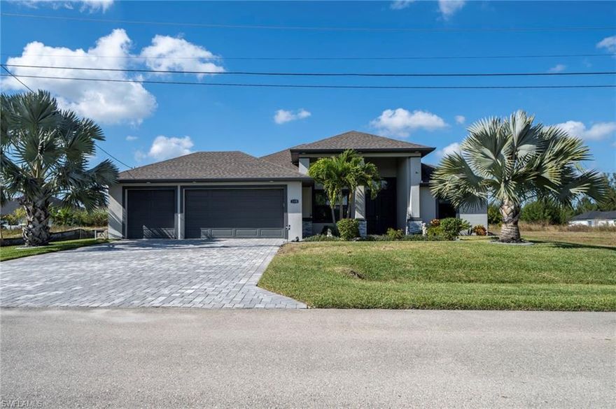 **NO FLOOD ZONE**  This 4 bedroom spec (fresh water canal) home is 4 years young, being sold FURNISHED and is in IMMACULATE condition! ALL city utilities are IN and ASSESSMENTS are PAID! Located in a desirable SW Cape Coral location, close to Trafalgar Middle, Grade school(s) and the New Christian Life Academy. The home was built in 2021, with only one owner who put so many upgrades into it, that it is a MUST SEE! Between Kevlar roll down shutters, custom shades and window treatments; Generac generator (with transferable warranty) plus a Sonos surround system. Updated landscaping (high end palms) (with irrigation) plus curbs were installed. As you enter the grand double doors, you have a sense of this modern beauty with it's amazing high tray ceilings which provide an open feel to the living room and kitchen; ceramic tile, high end furnishings and lighting throughout. Gorgeous light and bright custom “soft close” cabinetry in the kitchen with granite counters and glass mosaic back splash. Upgraded Samsung Stainless Steel appliances (including convection oven and wine fridge) washer and dryer. The main bedroom is spacious and outfitted with walk-in closets; the main bath has a large walk-in shower featuring separate vanities. The opposite side of the home has (3) spacious bedrooms connecting to a gorgeous guest bathroom which features a porcelain tub, granite counter and access to the pool / lanai area. Your outdoor oasis faces west and has paver decking with plenty of room for a kitchen (new in-ground propane tank) plus room to sun and entertain. Custom paver driveway, lanai and walk-ways plus 3 car garage w/Husky shelving unit(s). Pool is heated. Great for a family, retirees or as an investment - schedule your appointment today- it's a beauty!!