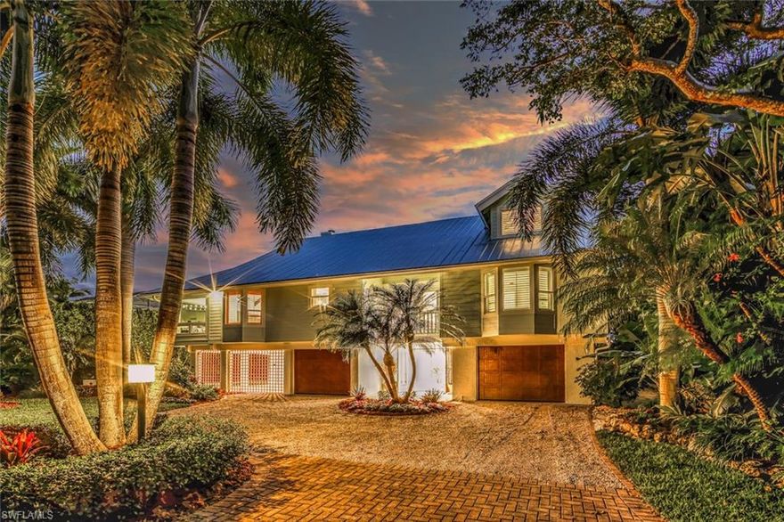 This is the one you've been waiting for! Beautiful island home on highly desired Isabel Drive, walking distance to Bailey Road beach where you can watch stunning sunrises and sunsets. You will find impressive finishes throughout this home including an open kitchen with high-end stainless steel appliances & granite countertops, beautiful solid wood flooring throughout all living areas & bedrooms, neutral coastal decor, wood burning fireplace, an office perfect for working at home, and a private master suite with ample closet space & a private balcony with canal views. Step outside and enjoy Florida's endless summer on your expansive 800 sq ft Travertine tile patio and relax in the recently refinished pool. New AC units & pool heater. Boaters will love this home and the 60 foot dock with electric and water, and a 10,000lb lift. Canal is direct access to San Carlos Bay and will have you in open water in minutes. Furnishings are owned by staging company, and available for purchase by room.