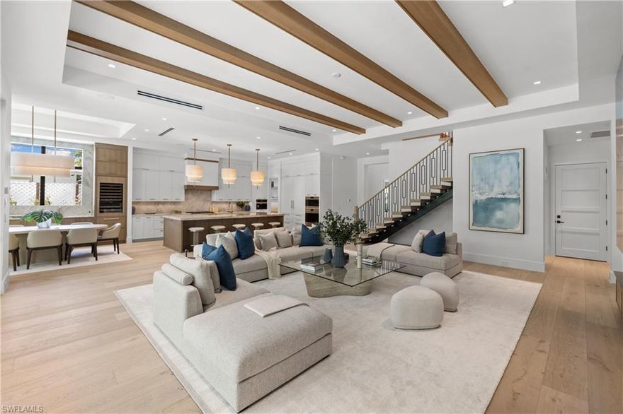 Unbeatable value for a brand-new luxury home in 34102. Just 4 minutes to the beach and Four Seasons Resort and 5 minutes to downtown Naples, Solterra offers ultra-luxury finishes, exceptional craftsmanship, and a thoughtful floor plan—crafted for the most discerning buyer seeking quality, style, and location. X-flood zone. Built by the renowned Glendale Group of SW Florida, this newly completed residence offers 4,466 square feet of beautifully designed living with 5 bedrooms, 5 full baths, and 1 half bath. A fresh modern aesthetic, elevated materials, and carefully curated architectural details define the home, while its exceptional quality, natural light, and livable design set it apart in one of Naples’ most exciting and evolving neighborhoods. At the heart of the home, the expansive chef’s kitchen and wine bar deliver both beauty and performance, appointed with Sub-Zero and Wolf appliances, a Galley workstation sink, Taj Mahal and Cristallo quartzite countertops, gas cooking, a built-in coffee system, and custom cabinetry designed for both function and style. The great room is a true showpiece, anchored by an Ocean Blue quartzite feature wall and a custom water vapor fireplace, with walls of glass and abundant natural light creating a warm yet sophisticated atmosphere. The floor plan is both functional and inviting. The primary suite offers a tranquil retreat with a spa-inspired bath, while a first-floor guest suite with en-suite bath provides flexibility for visitors or a home office. Upstairs, three additional guest suites—each with private baths—are complemented by a loft-style lounge and covered lanai, creating a comfortable and private space for family and guests. Additional highlights include white oak flooring throughout, a dramatic cast iron front door, statement “Glace” chandelier, advanced smart home technology, propane gas system, and a whole-house generator for added peace of mind. Designed for seamless indoor-outdoor living, the private backyard oasis features a sparkling pool and spa, summer kitchen, open-air lounge area, outdoor shower, and lush tropical landscaping—ideal for both relaxing and entertaining. Perfectly positioned in the heart of Lake Park, Solterra offers unmatched convenience and lifestyle. The Naples Design District, Lake Park Diner, and River Park are all within walking distance, while downtown Naples, the beach, fine dining, boutique shopping, and world-class resort amenities are just minutes away. Solterra is a rare opportunity to own a newly built, design-forward residence that combines elevated finishes, exceptional livability, and a premier in-town location.