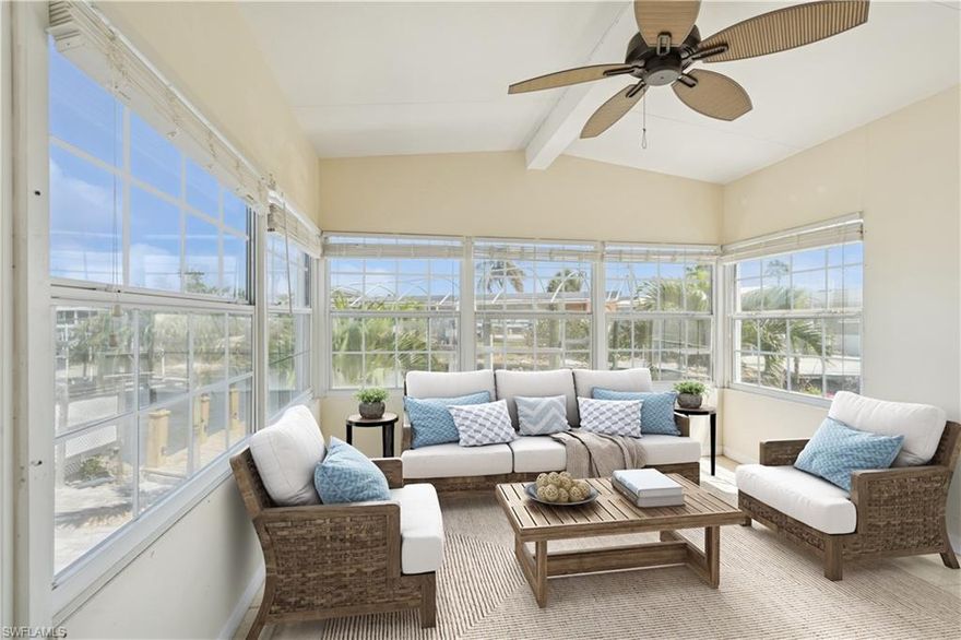 SELLER FINANCING AVAILABLE WITH JUST 10% DOWN! Located on a deep-water canal with direct Gulf access, this 3-bedroom, 2-bath home includes a 10,000 lb boat lift, kayak launch and a private dock. Perfect for boaters looking for a low-maintenance Florida home near the beach. Fully renovated inside after Hurricane Ian, the home features light gray waterproof luxury vinyl flooring, recessed lighting, granite countertops, white wood cabinets and stainless-steel appliances. The master suite includes two separate vanities and a walk-in tiled shower. Guest bath includes a tiled tub/shower combo. New AC, washer and dryer, and plenty of storage throughout. A one-car garage, carport and extra parking complete the setup. Located on San Carlos Island in a 55+ community with low monthly fees that include water, sewer and trash. Walk or ride to Fort Myers Beach, Doc Ford’s, Dixie Fish Company and the Key West Express. Whether you're looking for a seasonal escape or a full-time home, this is your opportunity to own a piece of paradise with unbeatable access to the water and all that Southwest Florida has to offer.  One or more photo(s) have been virtually staged.