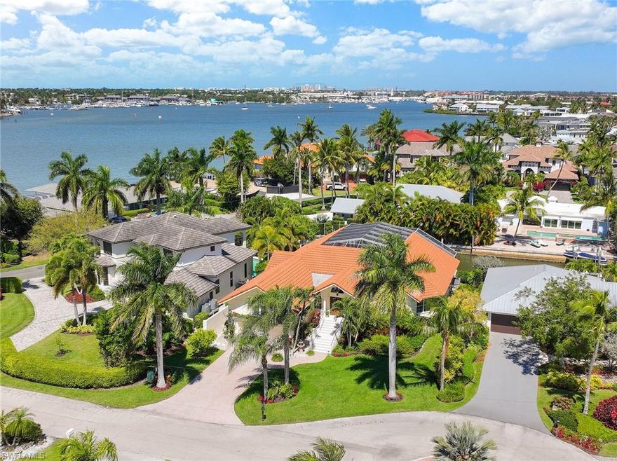 PRICED TO SELL! Here is your opportunity to get into the exclusive community of Royal Harbor. Live comfortably in this beautiful home forever or until you design a new one. The property is located in a prime Royal Harbor location, on a quiet cul de sac, with direct boat access to The Gulf of Mexico. It features an open concept with volume ceilings and large outdoor living space on a higher level than surrounding homes, creating privacy. The screen enclosed heated, saltwater pool overlooks the homes two boat lifts. All bathrooms and closets have been renovated. Don’t miss out! The possibilities are endless. AVAILABLE NOW!