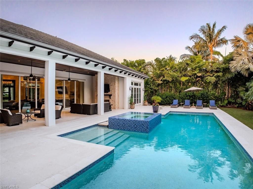 Photo of 702 BOBWHITE LN, NAPLES, FL 34108 (MLS # 225036920)