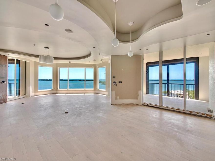 La Scala 10th floor premier 04 unit that is undergoing complete renovation, anticipated completion mid Sept.,2022.  Simply the best waterfront un-obstructed Bay and Gulf views in Bonita Springs.  While upgrade list is too extensive to detail, here are some highlights: new light oak floors in all rooms and porcelain tile in 5 baths. New interior solid core 4-panel doors along with new base, entirely new Kitchen with Wolf & Subzero appliances and quartz counters. Custom designed laundry, new master bath with floating tub & vanities and enormous shower, new LED lighting in all rooms. Private elevator lobby allows first glimpses of this fabulous sky home through custom glass doors. Great Room features walls of floor to ceiling glass windows and doors. 3 Large en-suite bedrooms plus den & total of 4.5 baths in nearly 4300 SF, well over 5,000 SF when you include 3 large lanais. La Scala owners enjoy two levels of amenities including: two story formal space, billiards room, theater, and library. The fitness center and pool/spa are luxury sized for only 64 owners. Feel secure with staffed front desk 24/7. Colony amenities: Bay Club dining, 34-acre island beach park and optional equity golf