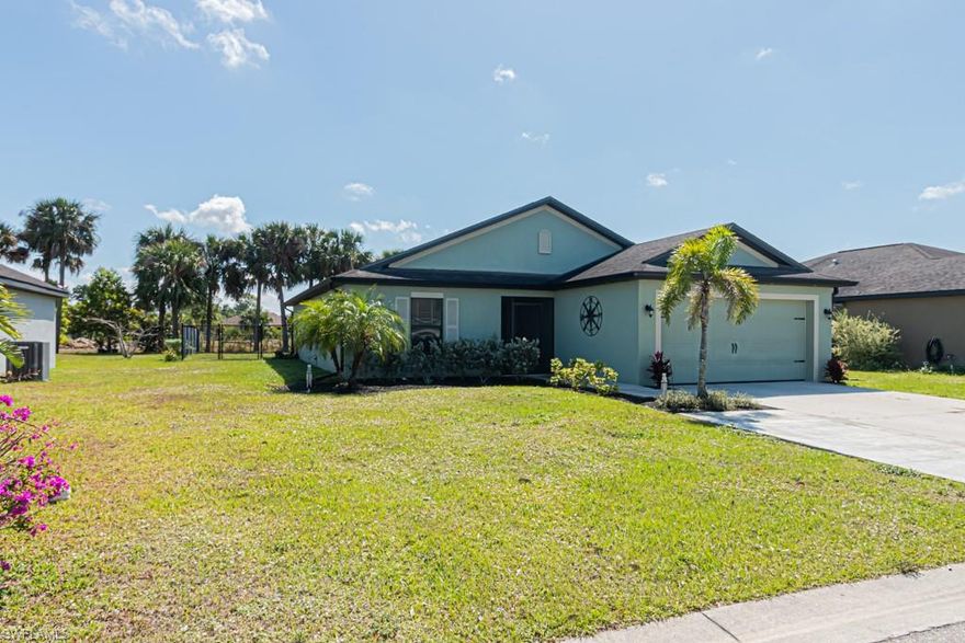 Get ready to move in your dream home today!!! This beautiful house is close to everything Lehigh Acres has to offer in a quiet gated community. The home features an open floor plan, 3 bedrooms plus a den, 2 bathrooms, 2 car garage, and it is surrounded by a natural landscape. Enjoy coffee on your lanai, while overlooking the tranquility of the canal. Property is fenced in so your children or family can enjoy the backyard. The floors have been updated to tile and bamboo laminate.