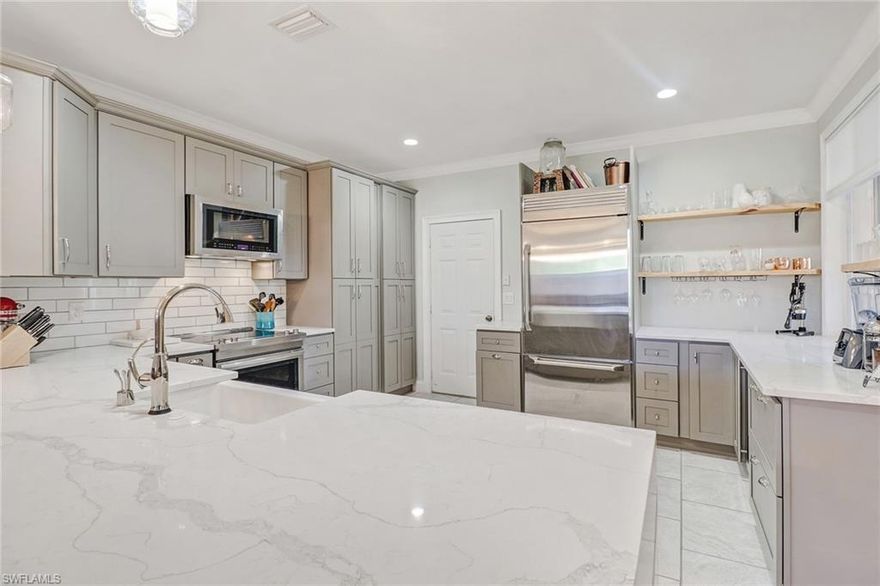 C.16526 - Wait till you see this one!! This home has been completely remodeled and updated!  One of a kind home at the Colonnade!  Owners have upgraded every room in the home!  Look at that Kitchen!  No detail has been overlooked.  Beautiful quartz counter tops that extend to the new tiled flooring with additional new cabinets, new pantry, and upgraded stainless appliances!  All new master bathroom including new larger tiled shower, new soaking tub, new above cabinet bowl sinks, and new cabinets.  All new tiled guest bathroom!  Every room has new crown molding and four inch baseboards.  All new window treatments!  Large upstairs family room has new built-in bookcase.  Notice all the new high end lighting and fan fixtures.  Home has been completely repainted with decorator assistance.  New Garage flooring!  Large lanai with storage. You wont want to miss this one of a kind home at an unbelievable low price.