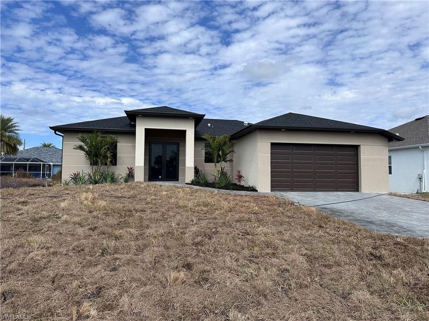 New construction with 3 bedrooms, 2 bathrooms, 2 car garages plus storage space, with 1,525 sq ft under air. This modern home features an open-concept layout and a designer kitchen with quartz waterfall countertops, custom cabinetry, and marble-style backsplash. Bathrooms include vanities and quartz and contemporary finishes. High ceilings, neutral tones, quality craftsmanship and tile floors throughout. Located in the prestigious waterfront community of South Gulf Cove, there is a boat ramp, with access to the Bay and Ocean. Only minutes to Boca Grande's and Englewood's white beaches, marinas, boat ramp, fishing, golf courses, restaurants, and shopping.