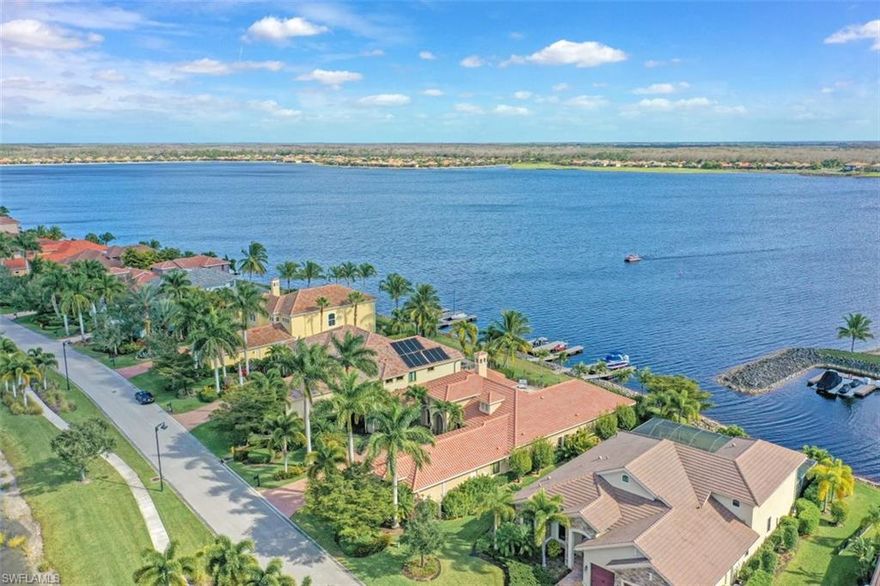 A ONE OF A KIND! This Arthur Rutenberg estate home is situated on a nearly half acre lot overlooking Stone Lake and the beach. Outfitted with a private dock and boat lift, you will enjoy 500 acres of navigable lakes and canals. From the moment you walk through the wrought iron front doors to the formal living room with wet bar and wine bar, luxurious kitchen with GAS range, exposed stained beams, multiple tray ceilings, rich moldings, pocket sliding glass doors to the lanai, and sweeping lake views, you are surrounded by pure elegance. Other fine appointments include: impact windows/doors; whole house water softener; garage AC; two gas fireplaces; tiki torches around the pool; hurricane & bug screen roll down shutters on the lanai; tile & wood floors throughout; and more! Furniture included. The Quarry is a lakefront community offering something for everyone: Boating, Golf, Tennis, Pickleball, Bocce Ball, Tiki Bar, Restaurant, Pool-Side Food/Drink Service, Gym, Social Activities including Full Time Social Director, and more! The Quarry offers a Private 18 hole Golf Club (Not Mandatory). An impressive $15M renovation and expansion of the Lake Lodge & Beach Club is under way.