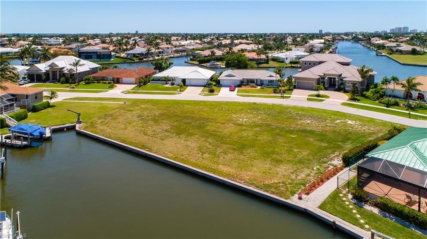 WOW! TAKE A LOOK AT THIS LOT ON SUNNY MARCO ISLAND THAT'S ALMOST THE SIZE OF 2 LOTS AT .37 ACRES ON THE WATER. THE LAYOUT OF THIS LOT PROVIDES THE LUXURY OF ENDLESS OPTIONS FOR THE DESIGNING OF YOUR DREAM HOME. THIS ESTATE SIZED LOT IS EXACTLY WHAT YOU HAVE BEEN LOOKING FOR TO ERECT YOUR CASTLE. 147 FEET OF WATER FRONTAGE FOR ALL THE WATER TOYS AND DOCKAGE. 2003 THE SEAWALL WAS REPLACED, AND THE PROPERTY IS ON SEWER WITH THE ASSESSMENT PAID. THIS LOT HAS IT ALL!