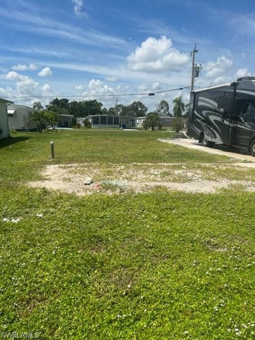 East facing lot (includes an A share) is situated within a short walking distance to the clubhouse, pools, hot tub, the boat ramp, tennis, basketball, and shuffleboard courts. The lot driveway was left in place during demolition and could be used to hook up an RV or travel trailer while waiting for the home of your choice to be delivered.  The Old Bridge Village (OBV) Community is an active 55 plus community located in North Fort Myers on the Caloosahatchee River.  OBV is an active 55 Plus community with social activities, an exercise facility, pickleball courts, and Palm Point, a picnic/ fishing area on the river just down from the clubhouse. A very convenient shopping center is located just outside the gate which includes a  grocery, pharmacy, sandwich shop,  barber shop, gas station, and a hairdresser. Watch the sunrise from your front porch, walk to the clubhouse for a swim or an activity, or grab your fishing pole and  picnic basket and enjoy Palm Point. Paradise awaits.