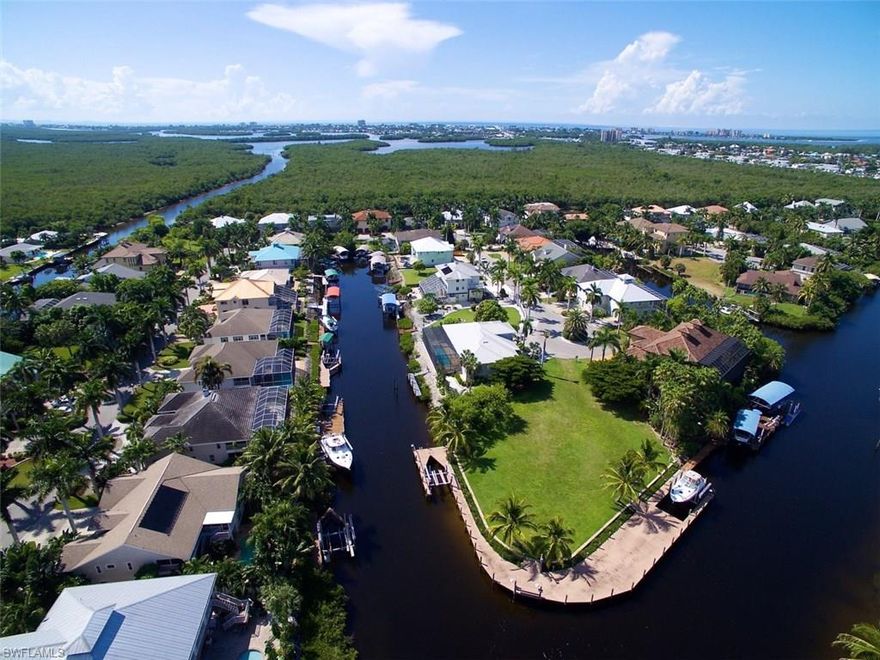 Look at the Virtual Tour....Palm Isles is one of SW Florida's Best kept secrets. Just off Fort Myers Beach. Huge Waterfront Lot will accommodate any size home you choose. Premium Waterfront Lot with over 275' of Seawall and Dock. 2800 Square feet of Dock Surface. There is a 24000 lb Boat Lift with Bunks for a Catamaran or Mono hull ( a $25,000.00 Upgrade ) Plus a 13,500 lb boat lift Also with Catamaran or Mono hull Bunks ). The dock has electric, security lighting, motion sensors, Snook Lights and running water. The lot has compacted fill so you can build a ground floor home. There is a full set of engineered architectural plans with 5493 SF Under Air Home with 1,656 SF attached 3 Car Garage/Workshop. We can Build to Suit and provide Architectural services to design your home or you can choose your own builder and architect. Lot is just under a half acre. Easy deep water sailboat access. Get the Beach feeling without the traffic. Short trip to the Back Bay and Gulf of Mexico.
