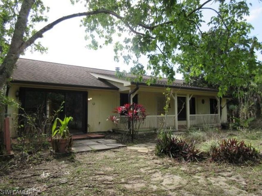 Good opportunity to purchase this fixer upper on acreage with privacy.   Lots of potential here!    Three bedroom, 2 bath ranch style home built in 1993 with cathedral ceilings and Fireplace in the living room.    Partially fenced lot with entrance gate.   Sold AS IS.