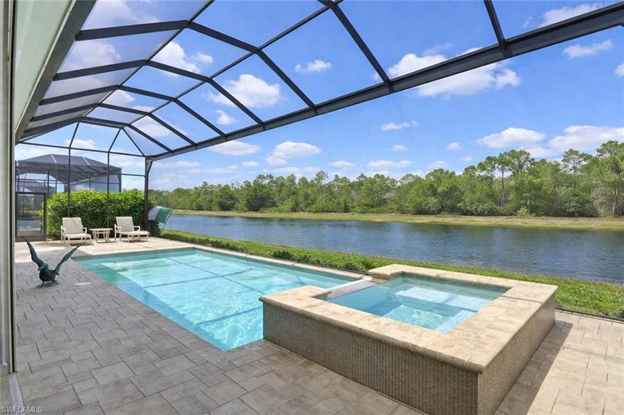Experience the pinnacle of luxury living in this Stock Development Madison model lakefront estate in the highly sought-after Crane Point at Naples Reserve, offering serene preserve views and the rare opportunity to install your own private boat slip behind the home as permitted by Naples Reserve. This custom-built 4-bedroom plus den, 4.5-bath residence showcases exceptional craftsmanship and designer finishes throughout, including soaring 16-foot ceilings with custom wood detailing, upscale lighting, wood-style tile flooring, plantation shutters, and ensuite baths in every guest bedroom. Designed with both comfort and innovation in mind, the home features Vitex Smart Home technology, a massive laundry room with built-in cabinetry, whole-home water purification, Blue-light A/C system, 500-gallon propane tank, electric hurricane screens, impact-resistant doors and windows, and an air-conditioned Wi-Fi-controlled 3-car garage. The gourmet chef’s kitchen is a showpiece with quartz countertops, premium appliances, a wine cooler, a pantry, and abundant custom cabinetry. The luxurious owner’s suite offers dual walk-in closets and a spa-inspired bath complete with a freestanding soaking tub and expansive glass-enclosed shower. Seamlessly blending indoor and outdoor living, the sprawling lanai is an entertainer’s dream with panoramic pull screens for uninterrupted preserve views, multiple lounging and dining areas, and a fully equipped outdoor kitchen with grill. Naples Reserve residents enjoy world-class resort amenities, including a state-of-the-art fitness center, lakefront resort-style pool and beach, tennis, pickleball, bocce, dining, walking and biking trails, two dog parks, children’s playground, and 22 scenic lakes for boating and water sports. One or more photo(s) has been virtually staged, AI-generated or rendered. (Agents see confidential remarks)
