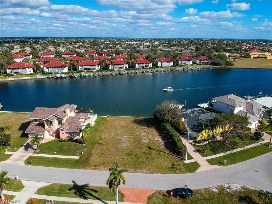 L.1928 - Beautiful wide open views from this over sized lot. New seawall in 2005. New bridge allows access for larger boats than any other indirect access lot on Marco Island, with nearly 14 ft height clearance.