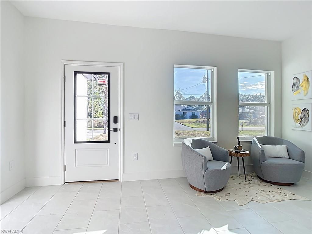 Photo of 422 Eisenhower BLVD, LEHIGH ACRES, FL 33974 (MLS # 226017978)