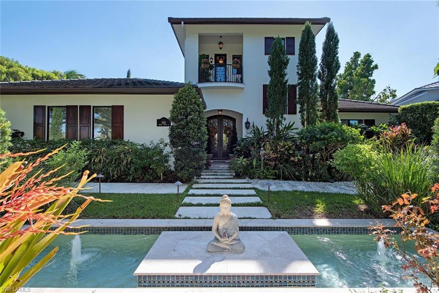This stunning custom home, designed by Falcon Design and built by Scholten Construction reflects the epitome of luxury living in Old Naples. The moment you enter this home through double wrought iron and glass front doors you are surrounded by high quality finishes: walnut and marble floors, high ceilings, crown moldings, large impact glass windows and French doors, gas fireplace. The covered lanai with summer kitchen and retractable screens and hurricane shutters overlooks the large pool and spa surrounded by lush tropical landscaping ensuring maximum privacy. The entire home is surrounded by flowering gardens, fruit trees and a walkway for you to enjoy your surroundings. The Bedroom on the ground floor overlooks the pool and the Master Suite on the second floor has a private balcony overlooking the pool area. Quality craftsmanship and masterful detail throughout. The two-car garage has tiled flooring and floating cabinets to maximize storage. Full house generator included. Only 7 blocks to Naples’ pristine white sand beach, this home has to be seen to be appreciated.
