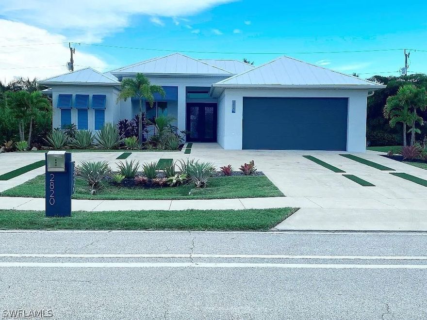 TURNKEY spectacular property, being sold fully furnished by Original Owner! Would make an ideal vacation rental investment property. California inspired custom built contemporary dream home. Newer built home completed end of 2020, no expense spared. Nestled in highly desirable Surfside/Beach Pkwy & Sands Blvd, surrounded by multimillion dollar homes. Southern exposure, huge wrought iron doors, Vibrant Bahamian shutters, 50 year metal roof, PGT hurricane impact windows, 90 degree vanishing 3D patio doors create a indoor/outdoor paradise. Professional landscaped tropical oasis exude backyard privacy, full automation, Pebbletec, infinity edge pool with sun-shelf, zero edge spa, multiple water features, picture screen window. 14ft tray ceilings, blue vein flooring. Tall double doors lead to office/den and master bedroom for exemplary touch. Spa like master bath, dual walk in rainfall shower. Will please the most discriminating buyer. Grab your fav bubbly, kick back in a ledge lounger and admire the phenomenal sunsets.