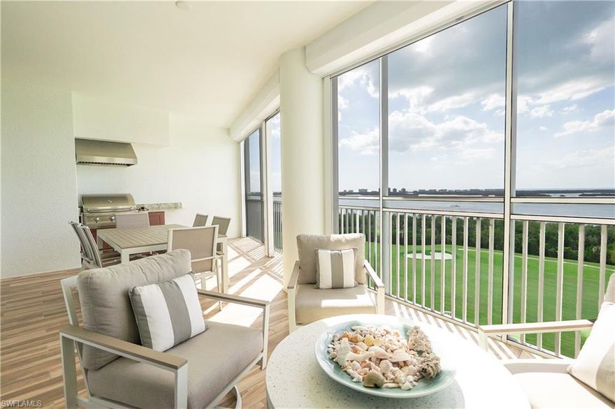 Welcome to Seaglass at Bonita Bay, where elevated coastal living meets designer sophistication. This beautifully appointed 3-bedroom, 3.5-bath residence features wide-plank hardwood floors, soaring coffered ceilings, and an open-concept chef's kitchen with Sub-Zero refrigerator, premium stainless appliances, quartz countertops, and a large island with seating. The sun-drenched great room opens to a spacious screened lanai with sweeping Estero Bay and golf course views — perfect for alfresco dining and entertaining. The primary suite is a true retreat with balcony access, spa-inspired marble shower, soaking tub, and dual custom walk-in closets. Both guest suites are generously sized with ensuite baths and beautiful treetop views. A stylish powder room, full laundry room with sink and cabinetry, and private elevator entry complete this exceptional home. Seaglass amenities include resort pool & spa, 24-hr concierge, fitness center, theater, rooftop terrace, and more. Bonita Bay offers a private beach club, marina, five championship golf courses, tennis, pickleball, and 12+ miles of trails. A rare opportunity to own one of SWFL's finest addresses.