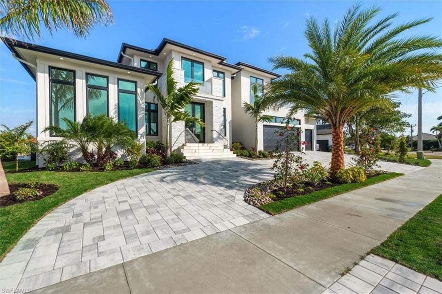 Stunning New Luxury Gulf Access Home Nearing Completion!!! Big wide water view with eastern exposure brings in abundant light. Completely custom with high end designer select finishes, fixtures and appliances. Features include new seawall, circular driveway, 400 amp electric service, decorator electric systems, custom pool/spa (heated), designed outdoor kitchen, 10' tall sliders, all impact windows and doors, high energy efficiency package, custom millwork, floating stairs, elevator, Wolf kitchen appliances with 48" gas range, custom showers and much more (see attached Features Sheet). Completion summer 2025. Act now to secure your piece of Marco Island Paradise!