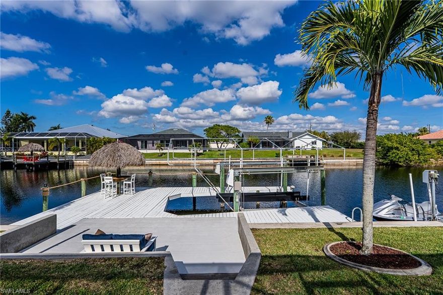 Gorgeous Gulf Access, Saltwater Pool Home in SW Cape Coral! Now Available! 3 Bedrooms 2 Full Baths. Fabulous Outdoor Entertaining Area - Perfect for Enjoying the Florida Lifestyle with its’ Sparkling, In Ground Heated Swimming Pool with Screened and Extended Lanai with Great Sized Under Cover Area, Concrete Dock Plus Expansive Walk Around Dock with Two Boat Lifts plus Water and Electric Available, Peaceful Water Views, Amazing Sunsets, Mature Palms, and Your Own Tropical Tiki Hut! One Boat Lift and One Jet Ski or Dingy. Welcoming Large Tiled Double Door Entry Foyer with Decorative Inlay Tile. Open Floor Plan. Good Sized Split Bedrooms with Extra Large Closets. Tile Flooring Throughout! Large Bright Dining Room with Palladium Window. Huge Kitchen with Lots of Solid Wood Cabinetry, Counterspace, Storage, Solid and Glass Doors, Granite Countertops and Backsplash, Recess Lighting, Desk and Buffet Area, Stainless Steel Appliances, Large Pantry, and a Breakfast Bar! Living Room and Large Family Room Each with Canal and Water Views! Tranquil Main Bedroom Suite with Sliders, Pool and Water Views, Walk In Sized Closet, and En Suite Full Bath. Coastal Style Main Bath with Jacuzzi Brand Jetted Corner Tub, Walk in Tile Shower, Dual Sinks and Water Closet. Tiled Guest Bath with Tub Shower Combination. Recent Updates and Upgrades Include: New Main Bath Shower Floor, 4 New Canal Facing Hurricane Impact Windows, New Stove with Double Ovens, New Interior and Exterior Paint, Upgraded Faucets and Beautiful Fixtures including 7 New Spectacular 72 Inch LED Light Fans, Lovely Inside Laundry Room with New Cabinetry, Quartz Countertop, and Utility Sink. New Window Treatments. New Water Heater. Two New Mini Split Heating and Cooling Units were Installed. New Side Entry Garage Door. Newly Painted Dock. New Dock Solar Lights and Upgraded Outdoor Shower. Newly Upgraded LED Pool Light and Pool Filter upgraded to Salt. Accordion Shutters Windows/Lanai. Young Roof 2020. See Aerials and Floor Plan Too! Hurry to Schedule Your Showings Today! Simply a Must See Home!