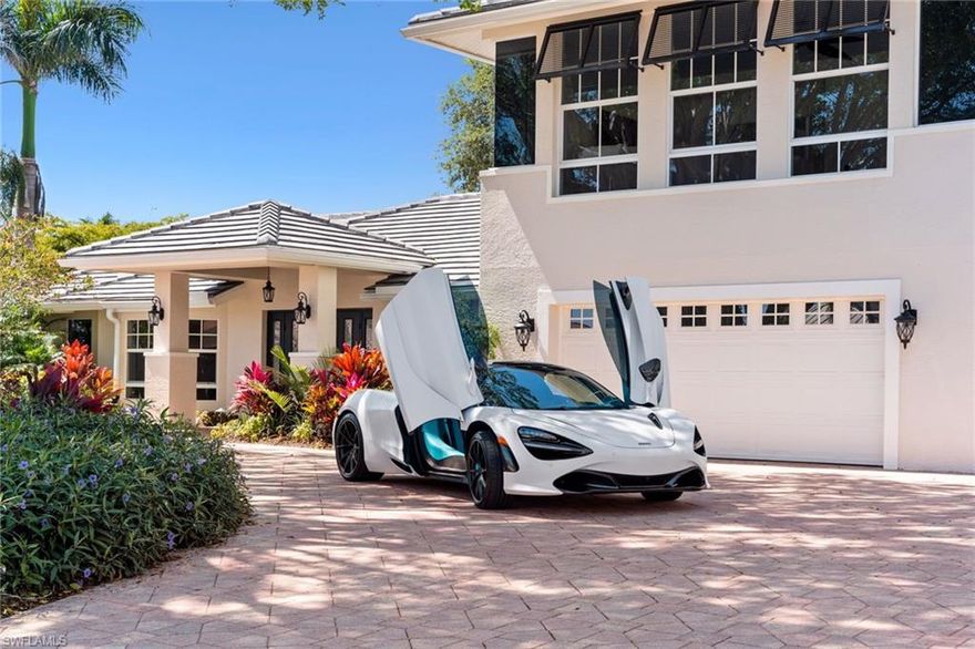 Complete renovation in 2020 completed by JP Coleman Construction, with final updates in 2023 completed by Matt Knauf with Knauf-Koenig Group. All windows are impact, shutters are on order for the sliders, garage & decorative windows in bonus room. You will immediately be captivated by this well-appointed 2-story home on one of the most desired streets in Park Shore. The oversized circular driveway is situated around a gorgeous banyan tree, and surrounded by a lush tropical landscape. This home features 4 bedrooms, an office, 4.5 baths, and a large bonus room upstairs with infinite possibilities! The Chef’s kitchen offers a six burner gas range, beautiful pull-out cabinets, ample seating, and a large bar area with built-in wine cooler.  The pocketing sliders, and open concept indoor/outdoor living space allows for seamless entertaining. You'll find an abundance of natural light from the well designed placement of large windows throughout. The outdoor oasis features a custom wood ceiling, an expansive gas heated pool and spa, and maintenance free turf out back.  Just some of the thoughtful updates include, new paint throughout, newer flooring, new epoxy floors in the garage, updated bathrooms, whole home generator and new roof in 2020! With a coveted location just steps away from The Waterside Shops, Venetian Village, world-class dining, entertainment and private white-sand Gulf beach access for Park Shore residents, you can truly enjoy SW Florida coastal living.