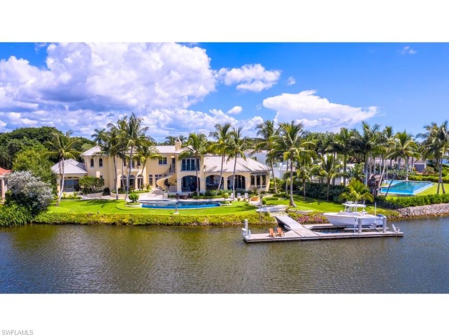 Situated on a large lot and one half, this exquisite estate has commanding panoramic views over the wide waters of Galleon Cove, a most sought after location within Port Royal. Superb taste is manifested throughout with remarkably detailed elements of stonework and rich wood. Creatively designed by Harrell & Co. Architects - Florida, Inc. and built by BCB Homes, Inc., the home’s numerous “shore parallel” rooms take full advantage of the exceptional western views from this unique waterfront setting. Approximately 207 feet of water frontage per the plat and/or deed. The casual rooms, detailed with the same level of intricate craftsmanship as the great rooms, welcome comfortable retreats, dining, and entertaining both inside and outside. Impressive master suite is accompanied by 4 guest bedrooms in the main residence and a "self-sufficient" 5th guest suite with its own exterior entry. The meticulously maintained residence offers 6 garage bays and large motor court, sure to delight the automobile enthusiast. Elegant grounds and verdant landscaping are complimented by a significant concrete floating dock and lift appealing to the avid yachtsman. Port Royal Club membership eligibility.