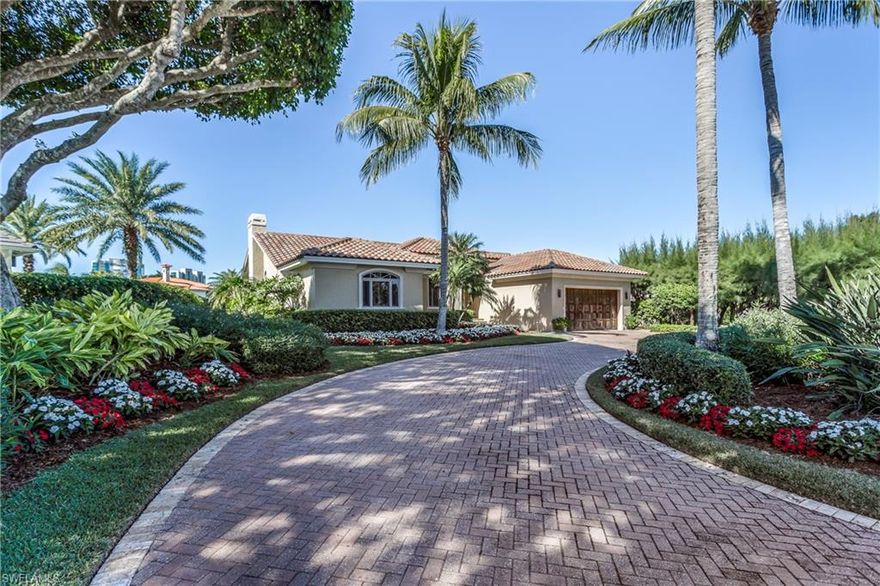 Park Shore 4 bedroom 3 full bath waterfront  home.  Absolute mint move-in condition.  Large family eat-in kitchen area with separate living and dining area both with high impact windows and doors and pocket sliding door leading  to terrace pool area. A boater's dream with private dock and boat lift and gulf access through Dr's Pass.  Sunny and bright with western exposure for breathtaking sunsets.  Close to beach and Venetian Village shops and restaurants.