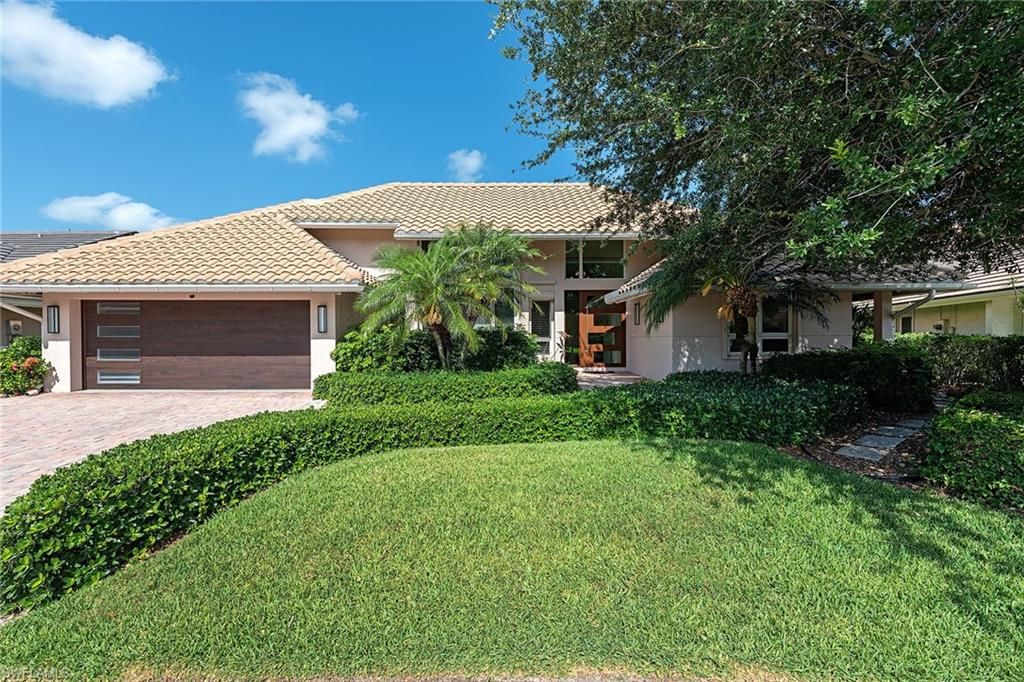 Photo of 805 Pine Village LN, NAPLES, FL 34108 (MLS # 225040887)