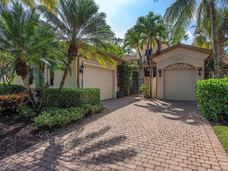 An intricate brick paver drive leads you to the courtyard entrance of this magnificent villa residence nestled in a lush tropical preserve. Elegant architectural columns greet you as you stroll through the grand foyer to the formal living & dining rooms. Crown moldings, arched passageways, and volume ceilings complement the lovely tile floors laid on the diagonal with stunning mosaic details. The spacious family room transcends into an exquisite entertainment space with stacking sliders allowing tropical outdoor views to fill the space with easy access to the outdoor living area. The gourmet kitchen features stainless appliances, natural gas cooktop, a double-oven, breakfast nook, and a built-in kitchen bar. The master suite is a tranquil retreat with a sunlit sitting area and a spa-inspired master bath featuring dual vanities, a walk-in shower, and a soaking tub. Two guest suites and a private home office complete this delightful open floor plan. A covered sitting area and dining space can be found on the loggia with views of the sparkling pool with spillover spa and lush tropical preserves all around. A three-car attached garage and new A/C complete this incredible pristine home.
