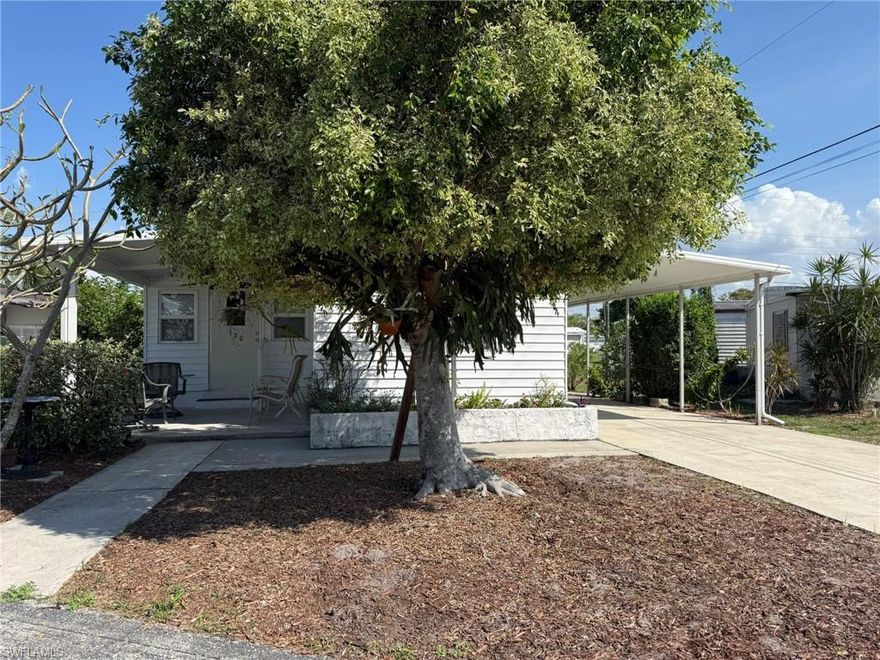 Great Opportunity To Own Your Own Home In North Fort Myers, Including The Land! And Located Just Off Of Bayshore Road, Minutes From I-75, Centrally Positioned Near Grocery Shopping, A Public Library, And Other Amenities. What An Affordable Way To Have Your Own Home, Or 2nd Home, Here In South West Florida! Mobile Manor Is A Quiet Old Florida Feel Mobile Home Community Enjoyed By Families Of All Ages. 120 Lantern Place Has Been In The Same Family Since 1990. Generations Have Enjoyed Wintering Here, Playing Games Here, Riding Bikes Here, Playing Shuffleboard Here. Renovated Over These Many Years To Accommodate A Growing Family's Needs: Expanded Living Area Through A Large Kitchen Pass Through Has Plenty Of Room To Enjoy Gatherings. Open Airy Eat In Kitchen With Cherry Wood Colored Cabinetry And White Appliance Package. A Split Bedroom Floor Plan Provides Privacy And Comfort For Overnight Guests Or Multi Generational Family. Two Updated Full Bathrooms, The 1st Has A Shower/Bath Tub Combination, The 2nd Features A Roomy Shower With Glass Doors Convenience! There Is A Secondary Exterior Door Out Of The Bedroom Hallway, Just Off Of The Kitchen That Leads To A Screened Porch Area, A Large Covered Carport, And A Utility Room With Workshop, Storage, And Washer & Dryer. This Home Is Well Maintained With A LOW Voluntary Community Fee Of Just $28.00/Month. Mobile Manor Has It's Own Water Plant For It's Residents Use And Convenience. PLease Schedule A Private Showing Today Of This Wonderful Next Chapter In Your Lifw's Story.