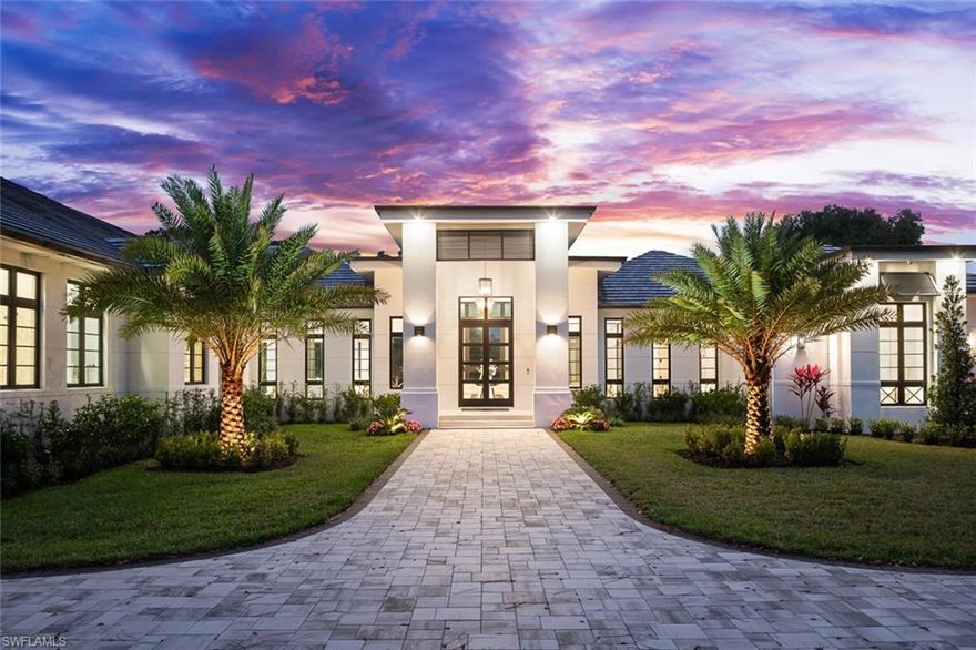 Discover a new standard of sophistication at 445 West Street, an exceptional custom-built residence that redefines the art of living in the heart of Naples. Nestled on a pristine 1.2-acre corner lot, this brand-new estate offers unparalleled privacy, seamlessly blending meticulous craftsmanship with timeless elegance. Upon arrival, you are greeted by meticulously landscaped grounds and a fully fenced perimeter, setting the stage for the architectural brilliance within. This 5-bedroom, 5-full-bath, and 1-half-bath residence is designed with the utmost attention to detail, incorporating a versatile den, a flex room, and expansive living spaces to meet every modern need. The home’s open-concept layout boasts exquisite finishes, from intricate coffered ceilings and mosaic tile accents to rich white oak wood floors and custom cabinetry. Chic light fixtures and hardware further elevate the space, creating an atmosphere of elegance at every turn. As you step into the grand foyer, your eyes are immediately drawn to breathtaking views of the saltwater pool, spa, and fountain, offering a serene and inviting backdrop. To the right, the primary suite is a true retreat, offering a spa-like bath, oversized closets, and a private office for moments of inspiration and productivity. To the left of the foyer, the great room elegantly combines the living, dining, and kitchen areas – a space designed for both grand entertaining and intimate gatherings. The gourmet kitchen is a culinary dream, featuring top-tier appliances, a gas range, and stunning Cambria quartz countertops. Custom cabinetry, a walk-in butler’s pantry, and a striking backsplash add both form and function. The adjacent dining area, with its floor-to-ceiling wine display, invites guests to indulge in fine dining while taking in the views. A sun-drenched breakfast nook overlooks the lanai, where the indoor-outdoor flow is seamless. Step outside into the expansive outdoor living area, designed for entertaining with a fully equipped summer kitchen. Positioned to capture the stunning western exposure, this private oasis offers panoramic views of Naples’ celebrated sunsets. For ultimate relaxation, the property features a sauna adjacent to the pool bath, providing a sanctuary to unwind and recharge. Surrounded by lush greenery, this residence offers the rare combination of privacy, tranquility, and the convenience of being moments from all the luxury Naples has to offer. At 445 West Street, the ultimate blend of unparalleled luxury, timeless design, and natural beauty awaits you.
