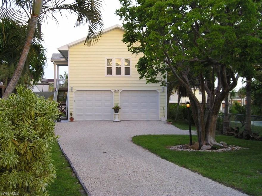 North of Pier, Waterfront Cottage in a  Unique, Quiet setting. Enjoy  Palm Trees, Sunshine, Boating, Fishing, from your own private Dock.    Completely Rebuilt (07) On Concrete and Steel Pilings, exceeding  elevation requirements. Quick direct boating access to  Bay, Gulf, River, (2 lots from Bay). Convenient beach access--one block.   Short walk to Times Square, Restaurants, Shopping, and Pier.  Room for a Pool and additions. Amazing sunrises and twinkling lights across the bay at night.   Less traffic on this Cul-de-Sac and Easy On and Off the Island.  Enjoy  living in this upscale neighborhood. Watch Dolphins play, Manatees swim and Pelicans and Osprey dive for Fish in your own back yard. A location  to enjoy the best of Island Lifestyle.