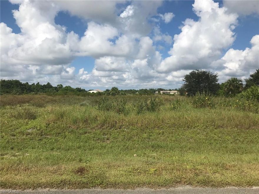 Wonderful opportunity for 6.21 acres of 100% Uplands (DEP attached) on a canal in a fantastic secluded neighborhood. Property is subdivided into two 3.11 acre lots to be sold together. Build on one or both lots, or build on one and sell the other. Very few trees, so clearing costs will be less. Beautiful home and property across the street. Big Corkscrew Island Regional Park under construction around the corner behind the Fairgrounds, with tremendous recreational amenities to come (see attached).