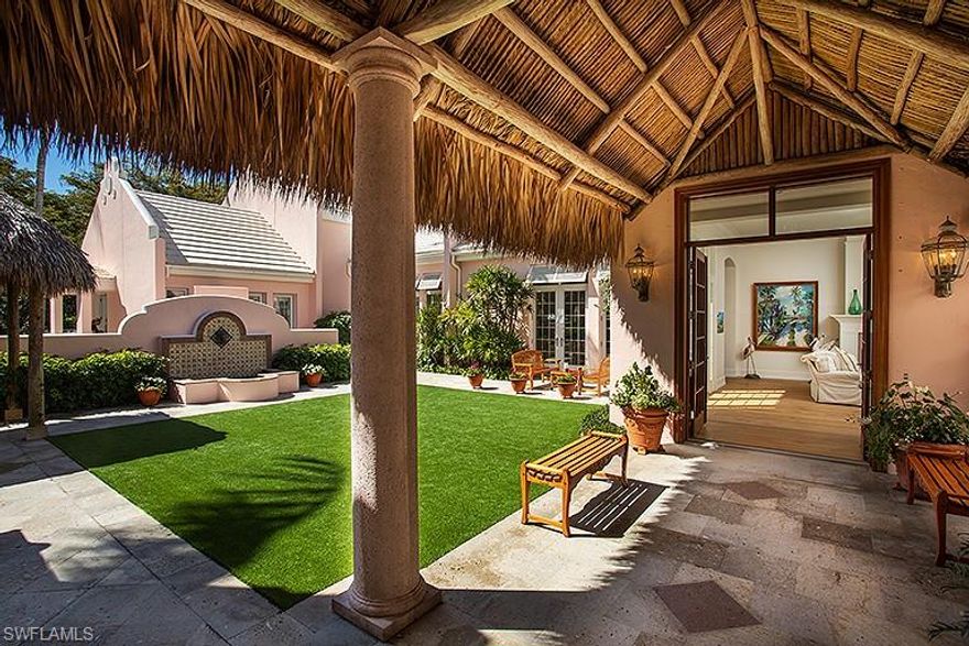 Perfectly situated within Little Harbour, a premier gated community consisting of only 32 residences and located between Port Royal and Aqualane Shores, this home offers a sophisticated spin to classical Bermuda-style design.Great attention has been given to implementing quality finishes and preserving the ultimate in privacy. In 2018, this elegant courtyard-style estate was masterfully renovated under the direction of the Williams Group, Inc.The property offers a total of 4 bedrooms,4 full baths and 2 half baths,including a beautifully appointed, private entry guest cottage. Walls of French doors surround the central courtyard area, adorned with romantic sitting areas,an outdoor wood burning fireplace and access to the southern facing pool area with spa. The interior offers European white oak flooring throughout, custom wood beam ceiling treatments and millwork, an interior wood burning fireplace, wine room and a chef-inspired kitchen and bar area. Common landscape and pool maintenance services are provided to all residents and exclusive leasing privileges are available at 9 community boat slips. This property is eligible for Associate Membership at the Port Royal Club.