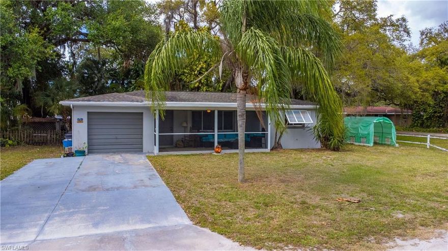 This wonderful 2 bedroom 1 bathroom home is oozing with potential in a great neighborhood, perfect for first-time homeowners or an investment property. Centrally located in North Fort Myers less than 2 miles from the Edison Bridge. Just a little TLC and this home could be your dreams come true. Surrounded by trees and flowers, this natural home features tile floors, an eat-in kitchen designed for cozy dinners, newly updated stainless steel appliances, and a washer and dryer. The back yard is nicely sized with native landscaping perfect for a garden or space for a beloved pet. Just a 3-minute drive to supermarkets and the cinema, and walking distance to schools, dog park and playground. 10 minutes from downtown Fort Myers..