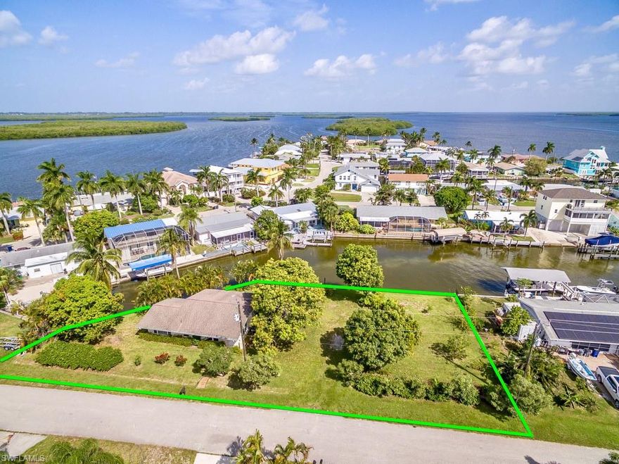 Don't miss your opportunity to own a fabulously maintained home on one of the largest Gulf access canal front lots in Matlacha. This 2 bedroom 1 bath home has been lovingly maintained by the owner and features, tile floors throughout, recently renovated bathroom, Hurricane windows, tankless hot water heater & large open kitchen. The many windows in the home provide a bright comfortable environment and views to the lush tropical landscaping with many varieties of native plants including Magnificent & Delicious Mangos, Avocado, Guava & Citrus trees. The nearly 1/3 acre lot gives enormous room for adding on to the existing home or space for a large pool and outdoor entertaining area. With nearly 200 feet of canal front access this home is a boaters dream!