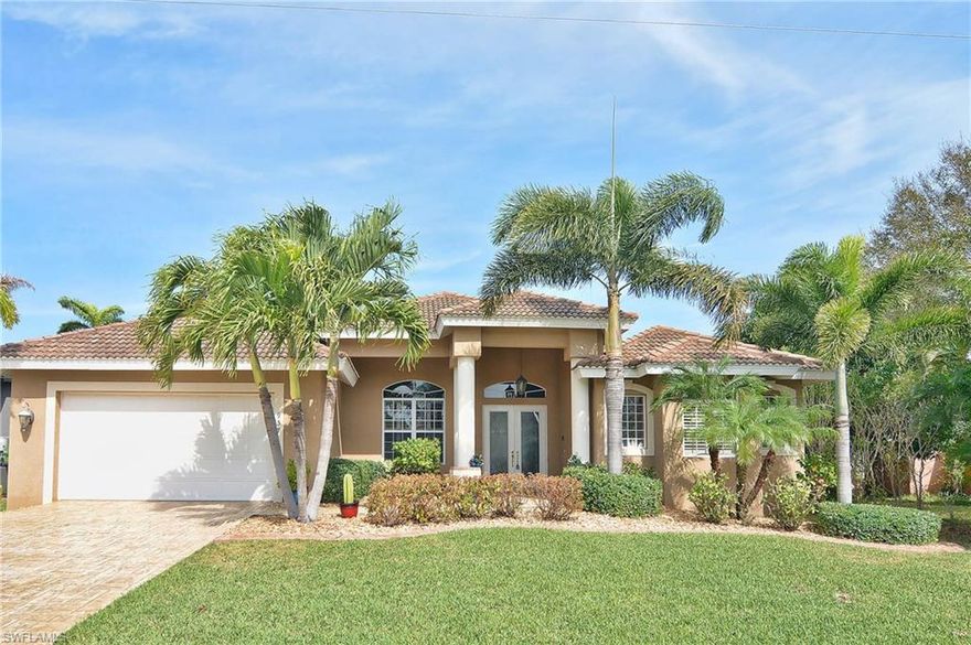 YACHT CLUB BOATERS DREAM...less than 5 MINUTES TO OPEN WATER...Launch your boat from your PRIVATE BOAT DOCK AND BOAT LIFT.  The SOUTHERN location of this residence allows for a quick trip to SANIBEL ISLAND, FT MYERS BEACH AND PINE ISLAND SOUND.  Built in 2007, this gorgeous 3 BEDROOM...3 BATH home has 2328 Sq Feet of fine living space.  TILE ROOF & Mature Landscaping provide terrific curb appeal.  Overlooking the INTERSECTING CANALS,  enjoy your HEATED POOL & SPA, in the oversized screened in lanai.  Inside are all the bells and whistles one would expect in such a fine upscale home, including a Chef's kitchen, complete with Wood Cabinetry, Granite Counter Tops and Stainless Steel Appliances.  BE SURE TO WATCH THE VIRTUAL TOUR.  You will love the spacious Master Retreat with its breathtaking water views.  The Master bath is beautifully appointed as well.  NO CARPET IN THIS HOME...ALL TILE!  ALL ASSESSMENTS HAVE BEEN PAID.  Walking distance to the Cape Coral Yacht Club.  This would make a fantastic Vacation Home!  Put this on your short list and call today to set up your private tour.