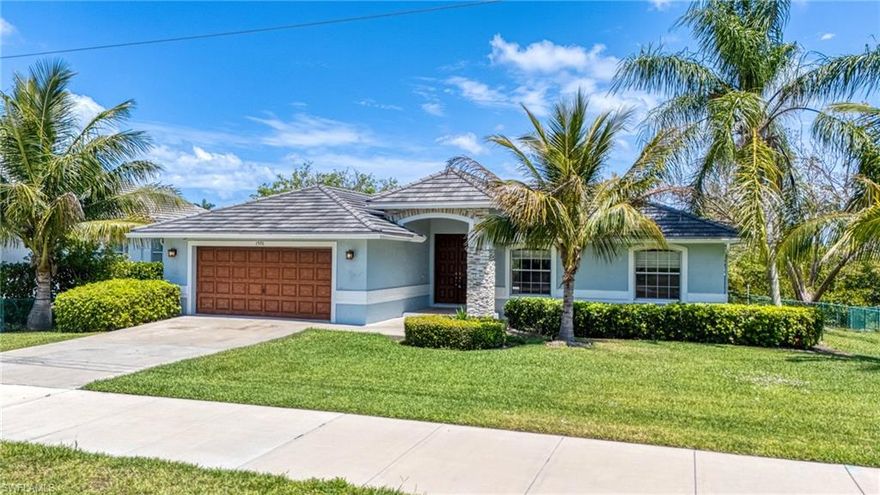 **Waterfront Paradise on Marco Island – Direct Water Access!** Just added over 15K in landascape to rear of home! Welcome to your dream home in beautiful Marco Island! *NEW- 15k in landscape and hardscape in rear.* This perfect single-level residence offers the stunning blend of luxury, comfort, and unbeatable location. Step inside to discover sparkling wood-like tile floors throughout and an airy, vaulted open floor plan that invites natural light and easy coastal living. The updated kitchen is a dream, providing updated cabinets, counters, pantry closet and appliances. Most of home boasts wide-open views of the tranquil canal and mangroves. The spacious primary suite includes a generous walk-in closet and a bright, well-appointed en-suite bath. Outdoor living is a breeze with a covered patio and screened lanai that surrounds a sparkling blue swimming pool—complete with a dedicated lap-swimming combo. Enjoy the privacy and peaceful ambiance of a unique waterfront position overlooking a protected mangroves island. Boaters will love the large composite dock, complete with a boat lift, offering direct access to the bay and on to Gulf. Surrounded by multi-million dollar homes, this property is not just a home—it’s a true value and an exceptional lifestyle opportunity. **Don’t miss your chance to own this slice of paradise—schedule your private showing today!**