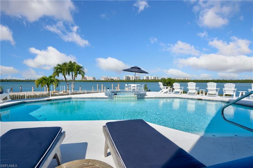 Views, views, views! A true boater's dream with over 270' on water direct. Rare to find beauty, just shy of half an acre on Marco Island. Bring the whole family as there is room for everyone in this unique Marco waterfront home. Over 3,600 square feet under air, a total of over 4,500 square feet, 4 bedrooms, 3 full and one half baths. Views from every room to watch the boats go by and bask in the sun in this oversized lanai and pool, complete with a built-in grill. Volume ceilings as you walk into the great room, formal dining area, formal den, huge eat-in kitchen with a separate living room for guests. Complete with 3-car oversized garage. Enjoy Marco Island living at its finest, enjoy the lifestyle you deserve!